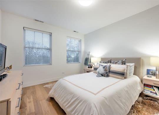 a bedroom with a large bed and a tv