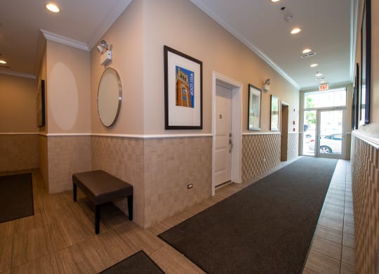 a hallway with a bench and a mirror and a door at Tripp 4321, Illinois