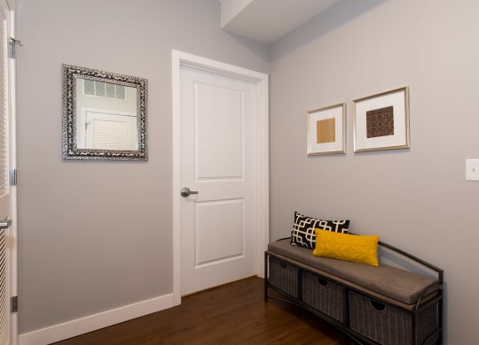 a living room with a couch and a door