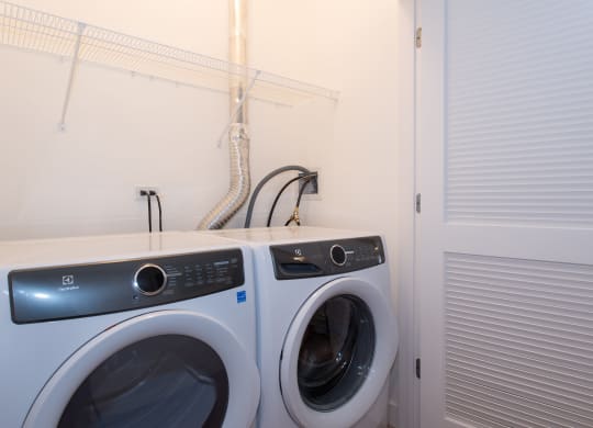 a laundry room with a washing machine and a dryer