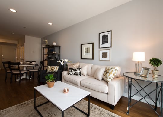 a living room with a couch and a table