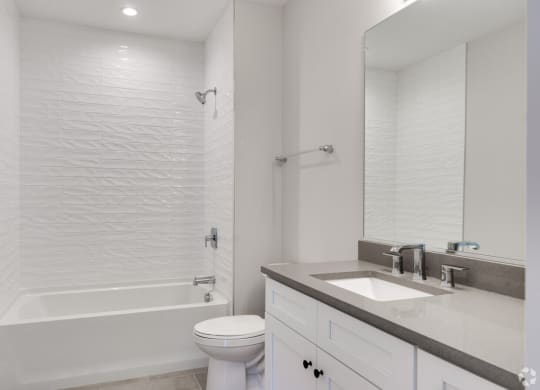 a bathroom with a sink toilet and a shower