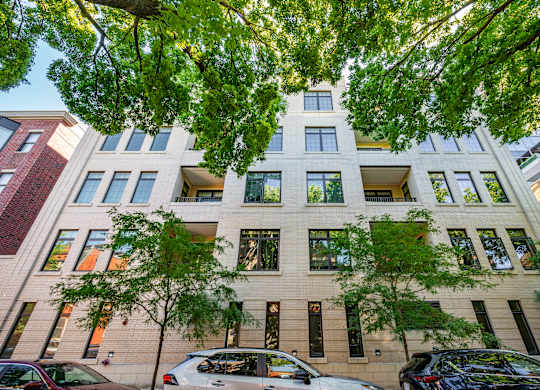 A modern building with a tree in front of it.