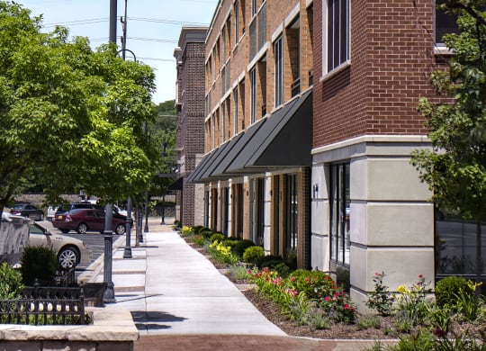 a large brick building with a sidewalk in front of it at Clarendon Hills 229, Clarendon Illinois