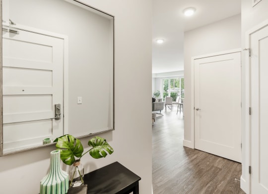 a hallway with white doors and a mirror at Barrington 101, Illinois, 60010 
