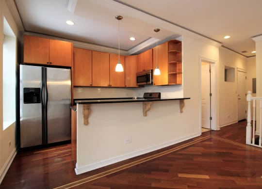 a kitchen with a counter top and a refrigerator