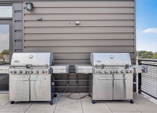 two stainless steel gas grills in front of a building at Barrington 101, Barrington, IL 60010