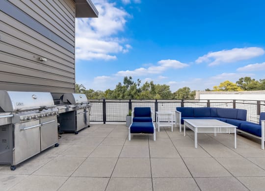 a patio with a grill and a table and chairs at Barrington 101, Illinois, 60010