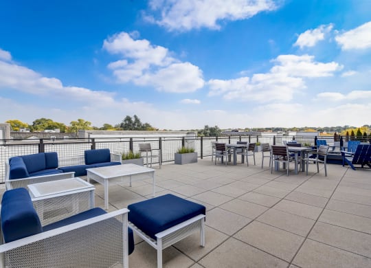 the terrace of the building has seating and tables at Barrington 101, Chicago