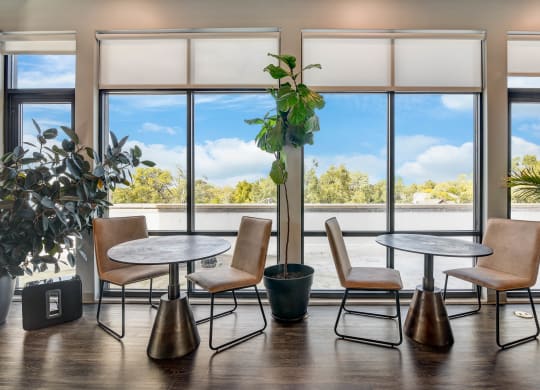 a meeting room with tables and chairs and large windows at Barrington 101, Barrington, IL 60010