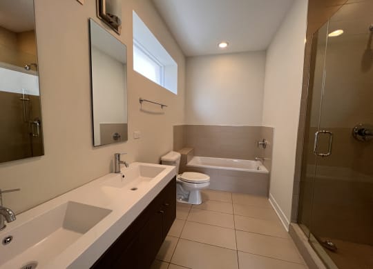 a bathroom with a toilet sink and a shower