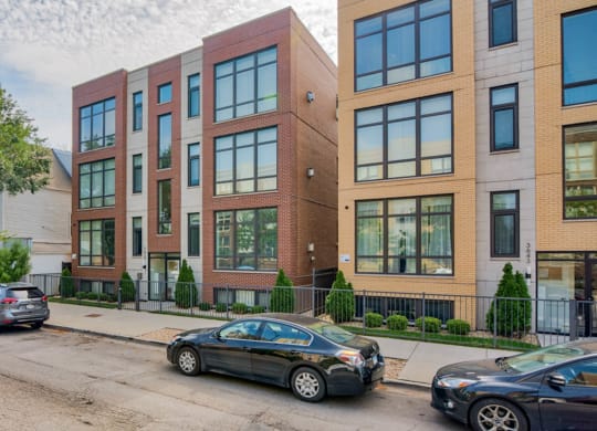 an apartment building on a city street with cars parked at Montrose 3634, Chicago, IL