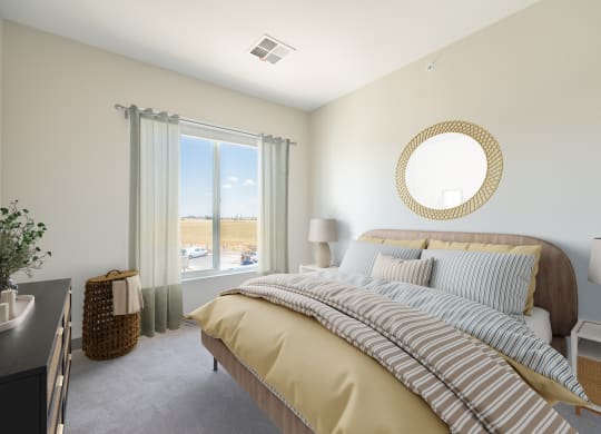 a bedroom with a large bed and a window