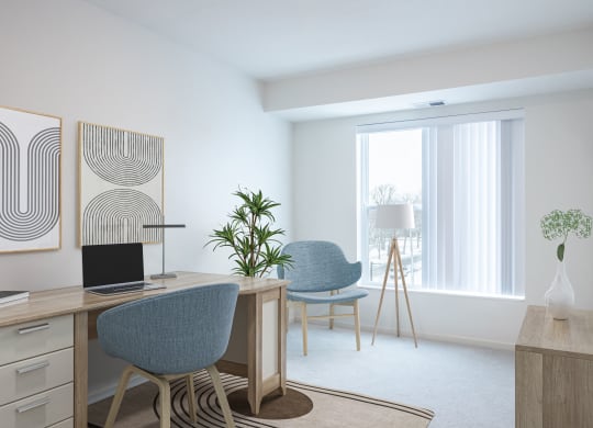a living room with two chairs and a desk with a laptop