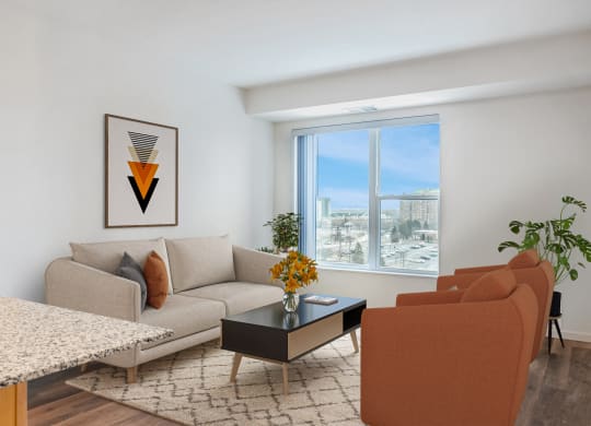 a living room with a couch and a table and a window