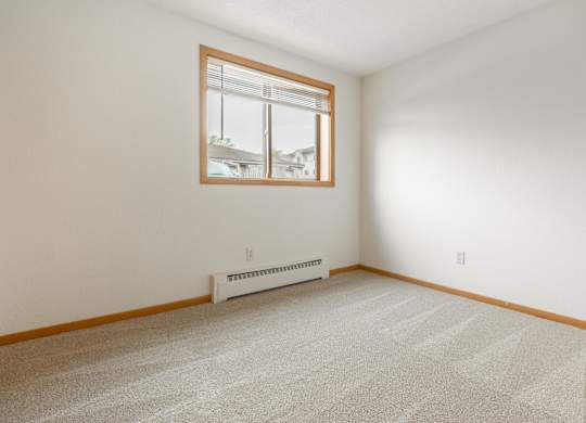 the living room of a house with a window at Ames Lake Neighborhood Apartments, St. Paul, Minnesota
