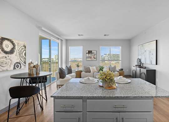 A modern kitchen with a dining table and chairs at Copa Flats Apartments, Maricopa, AZ, 85138