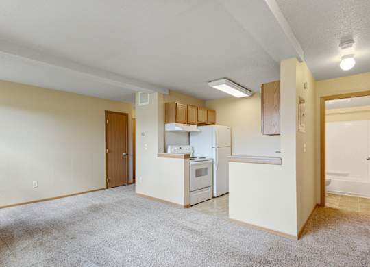 A kitchen with white appliances and a white refrigerator.