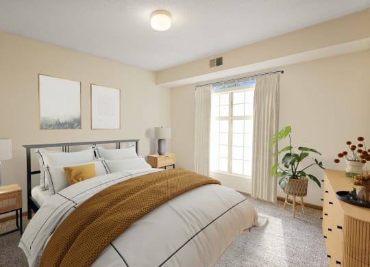 a bedroom with a bed and a window at Ames Lake Neighborhood Apartments, St. Paul, Minnesota