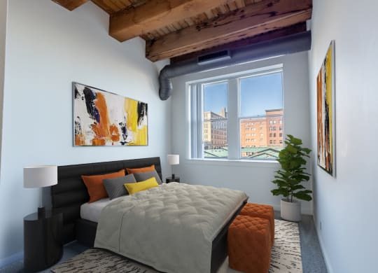 a bedroom with a bed and a window