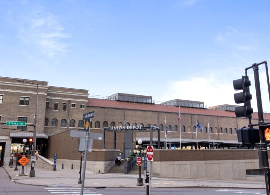 a large brick building with a traffic light in front of it