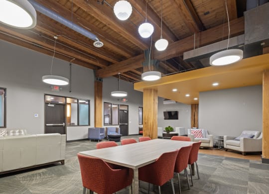 a conference room with a table and chairs