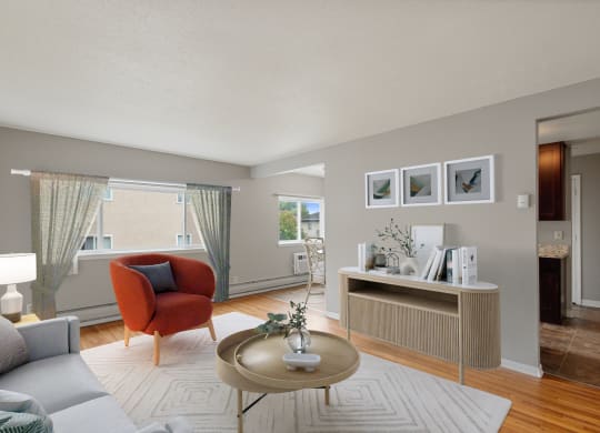 a living room with a couch and a coffee table at Ames Lake Neighborhood Apartments, Minnesota