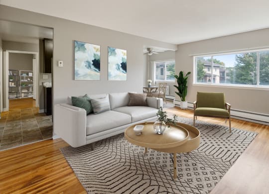a living room with a couch and a coffee table at Ames Lake Neighborhood Apartments, St. Paul