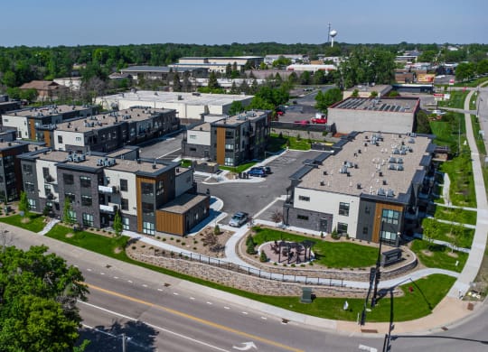 an aerial view of an urban area with buildings and a road