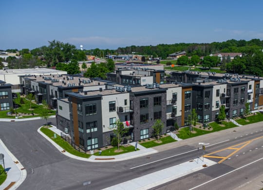 an aerial view of apartment buildings on a city street