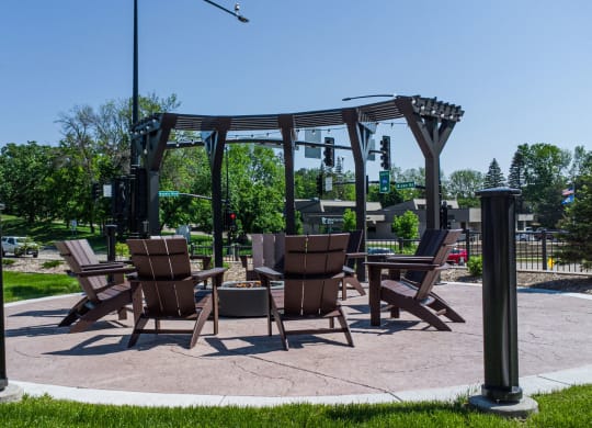 a patio with chairs and a table on a patio