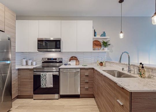 Spacious Kitchen With Pantry Cabinet at Grove80 Apartments, Cottage Grove, Minnesota