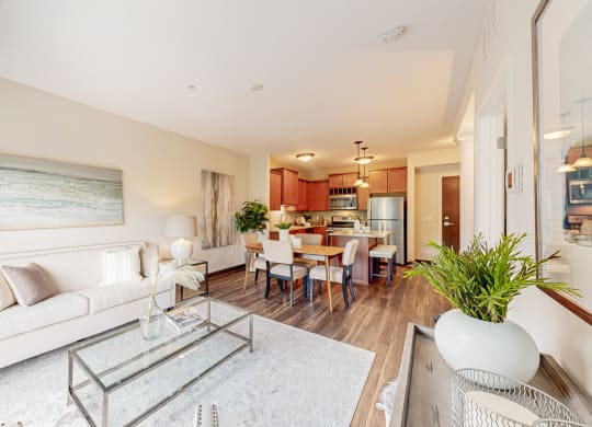 a living room with a couch and a glass table