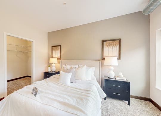 a bedroom with a bed and nightstand