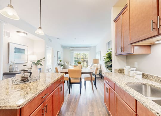 a kitchen with wooden cabinets and granite counter tops