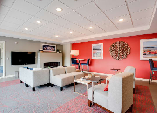 Community room with seating, tv and fireplace at Lake Jonathan Flats, Chaska, 55318