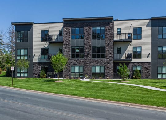 an apartment building on the side of a street