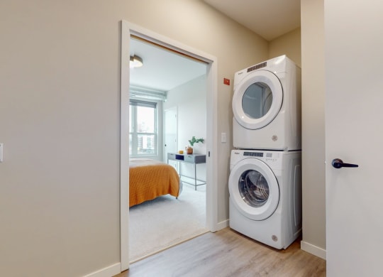 a washer and dryer in a bedroom