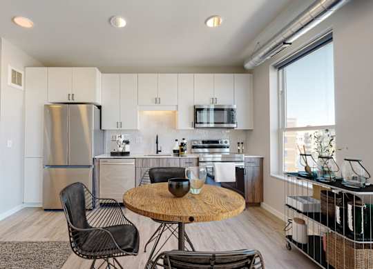 a kitchen and dining area in a 555 waverly unit