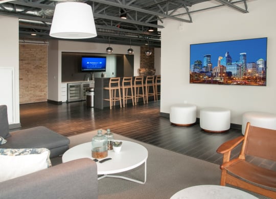 Community Room with Bar, Televisions and Seating Area at 700 Central Apartments, Minneapolis, MN