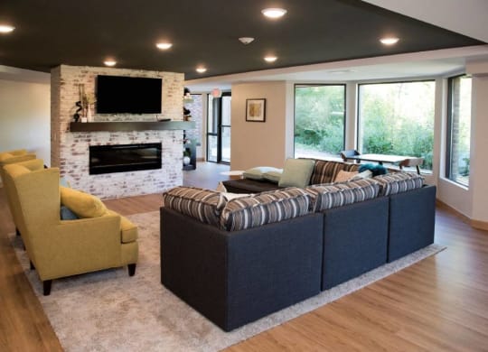 Community room with fireplace and tv at Aspenwood Apartments, Eagan, 55123