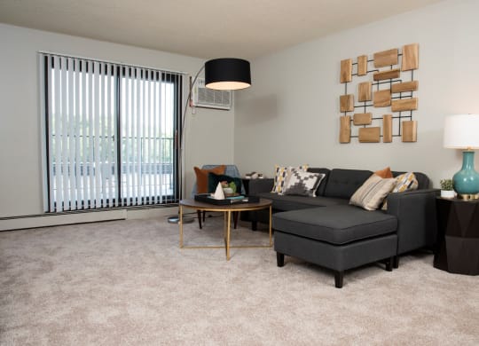 Spacious living room with private balcony, at Aspenwoods Apartments, Eagan