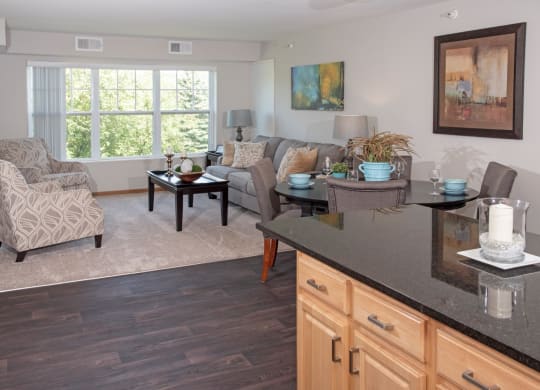 model apartment, kitchen island looking towards living room