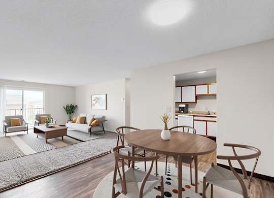 A living room with a brown table and chairs.