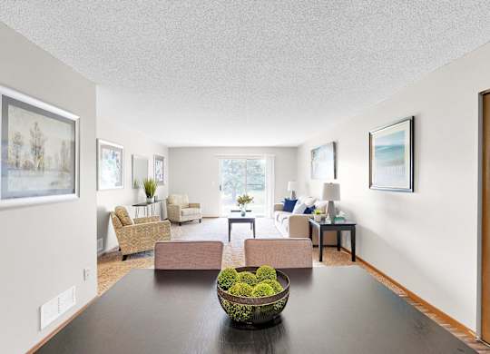 A living room with a brown table and chairs.
