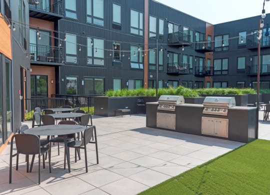 Outdoor Grill With Intimate Seating Area at CityLine Apartments, Minnesota, 55406