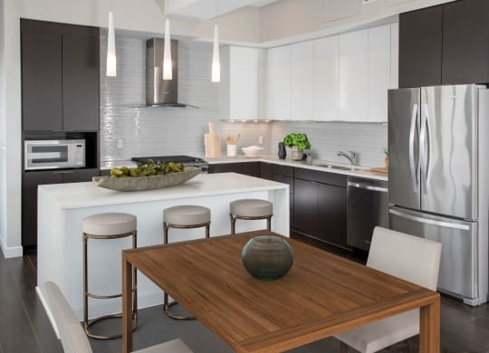 Kitchen with dining area at Custom House penthouse, St Paul