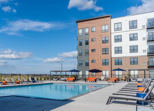 Pool With Lounge Chairs at The Edison at Maple Grove, Maple Grove, MN