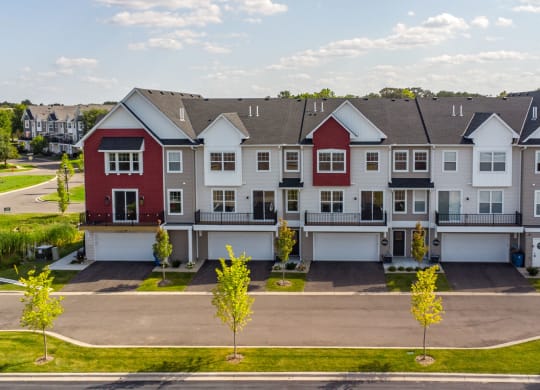 an aerial view of a row of townhouses in a street