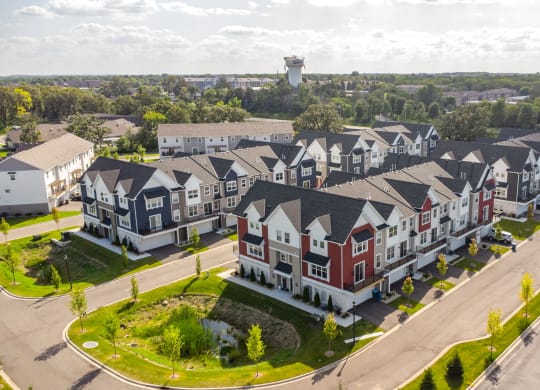 an aerial view of multiple townhouses in a neighborhood